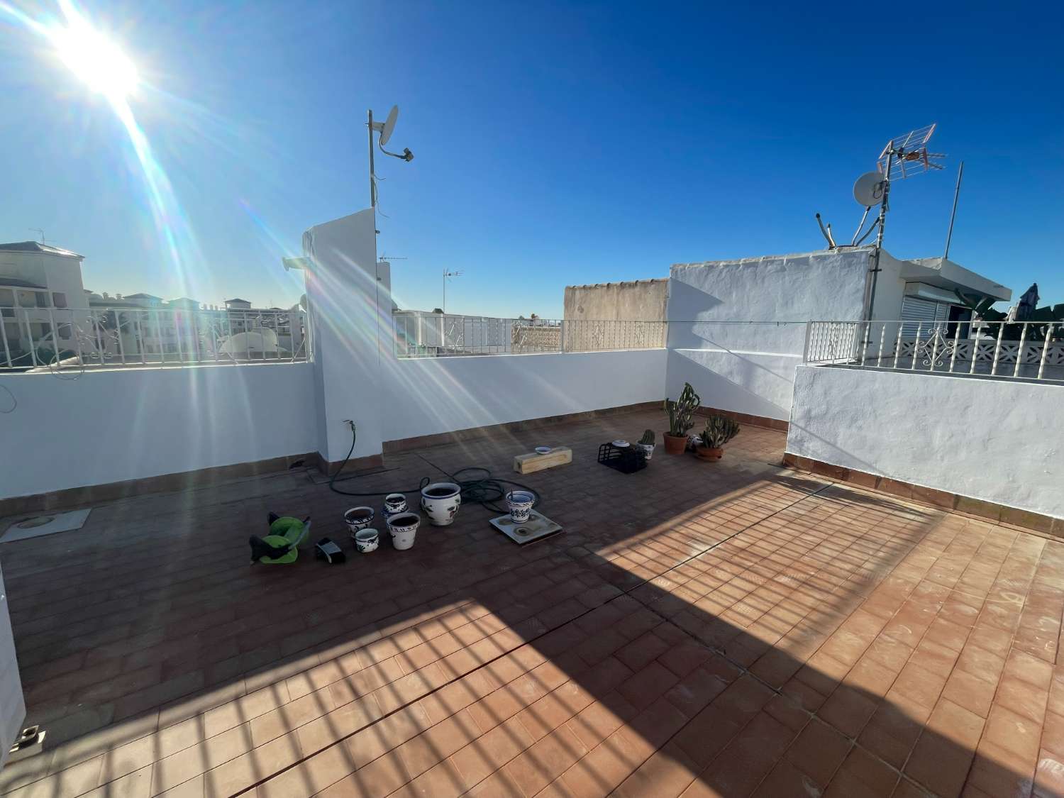 Top floor apartment with 2 bedrooms and 1 bathroom in front of communal pool.